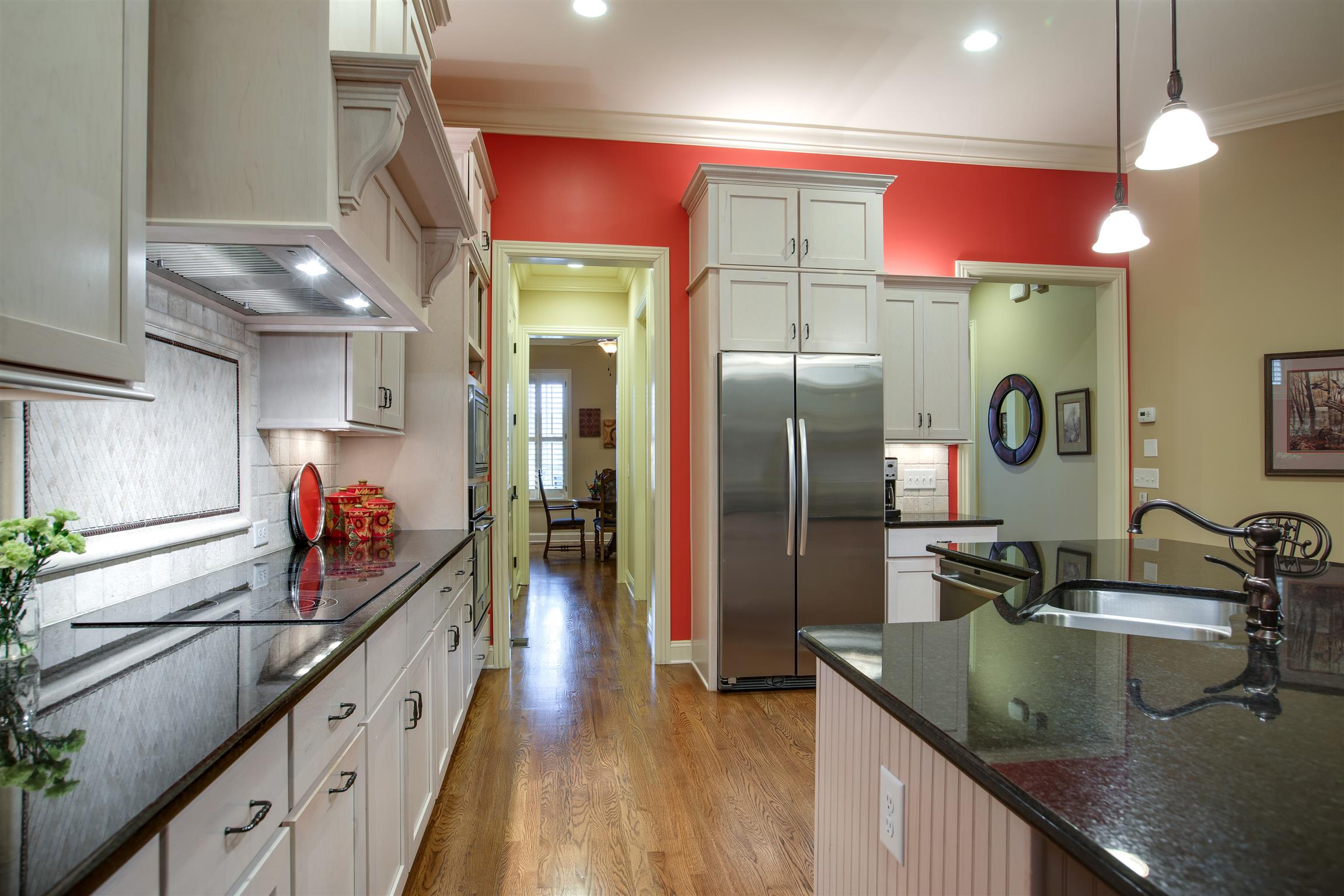 1417 Eliot Road Franklin, TN 37064 - Photo 13 of 29 Shaker Style cabinets in a light stain, tumbled stone backsplash, large pantry, and the stainless Refrigerator remains!