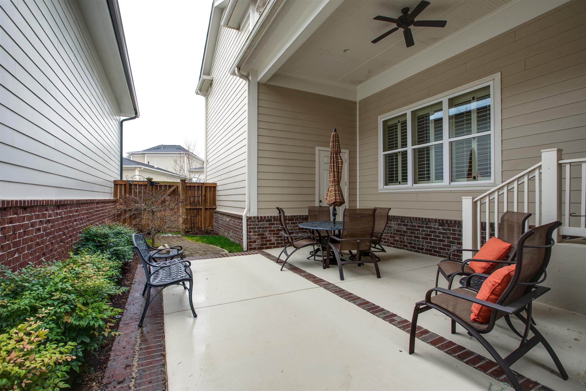 1417 Eliot Road Franklin, TN 37064 - Photo 22 of 29 Serene Courtyard is enclosed with a privacy fence, has a covered section of patio, plus an uncovered patio. Japanese Maple is just waiting to bloom!