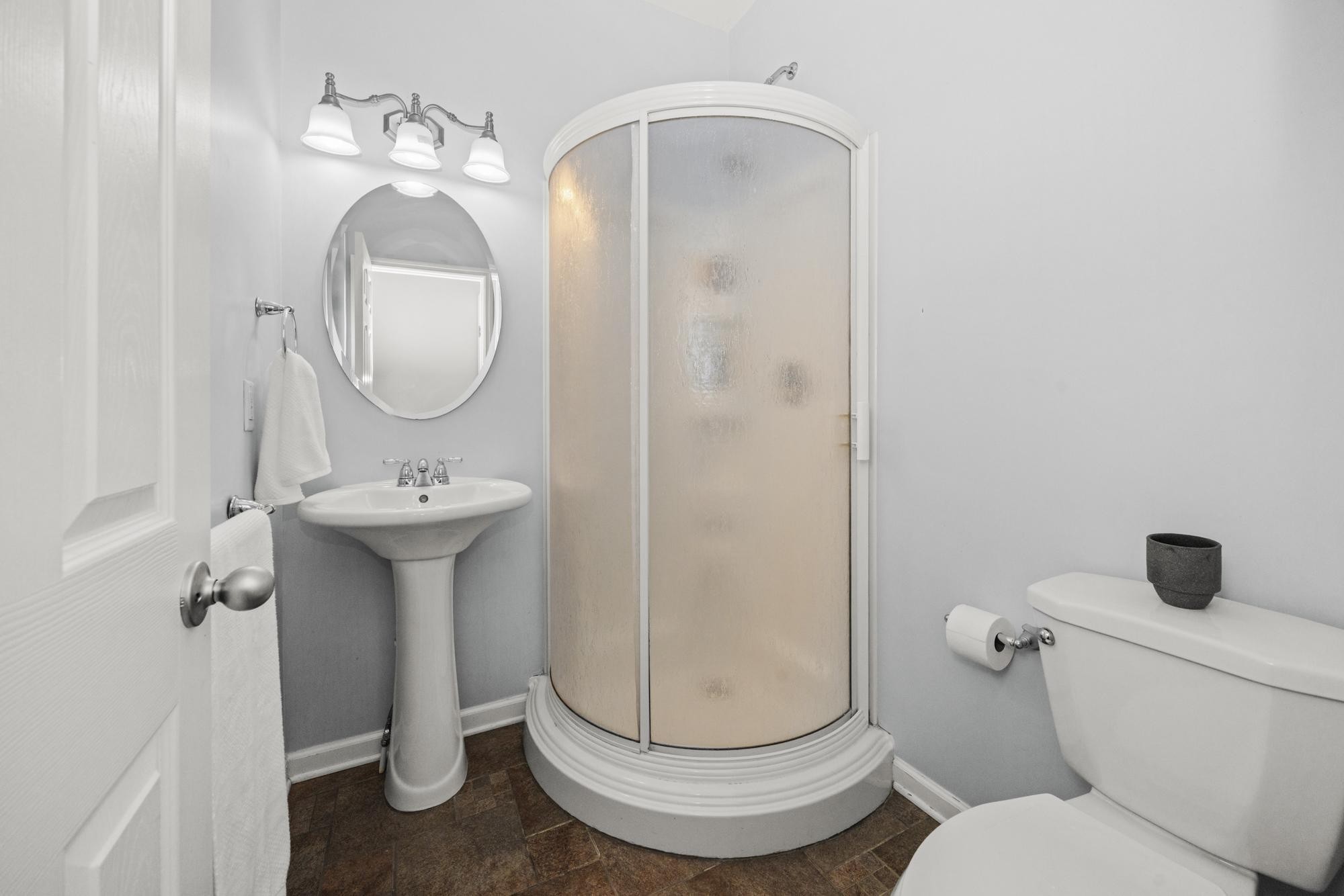 108 Stoddard Street Gallatin, TN 37066 - Photo 34 of 43 a bathroom with a toilet sink and mirror