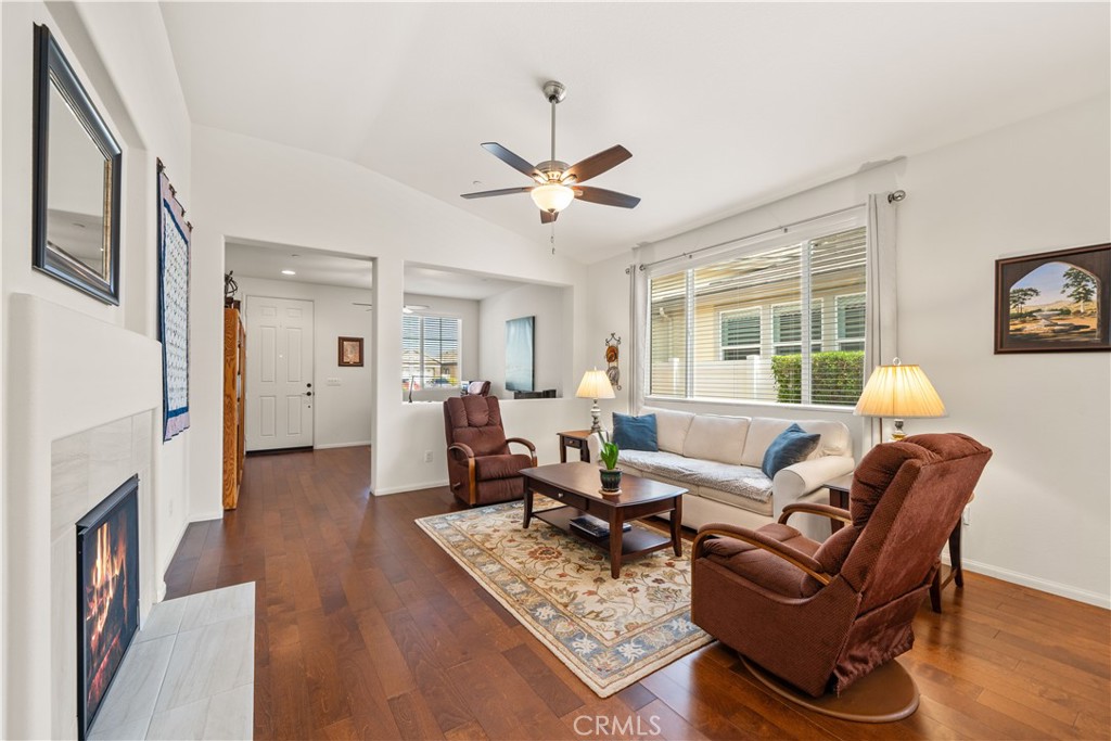 26519 Rim Creek Path Menifee, CA 92584 - Photo 14 of 45 a living room with furniture and a fireplace