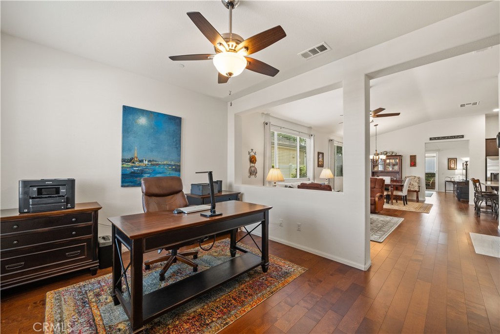26519 Rim Creek Path Menifee, CA 92584 - Photo 8 of 45 a workspace with furniture and wooden floor