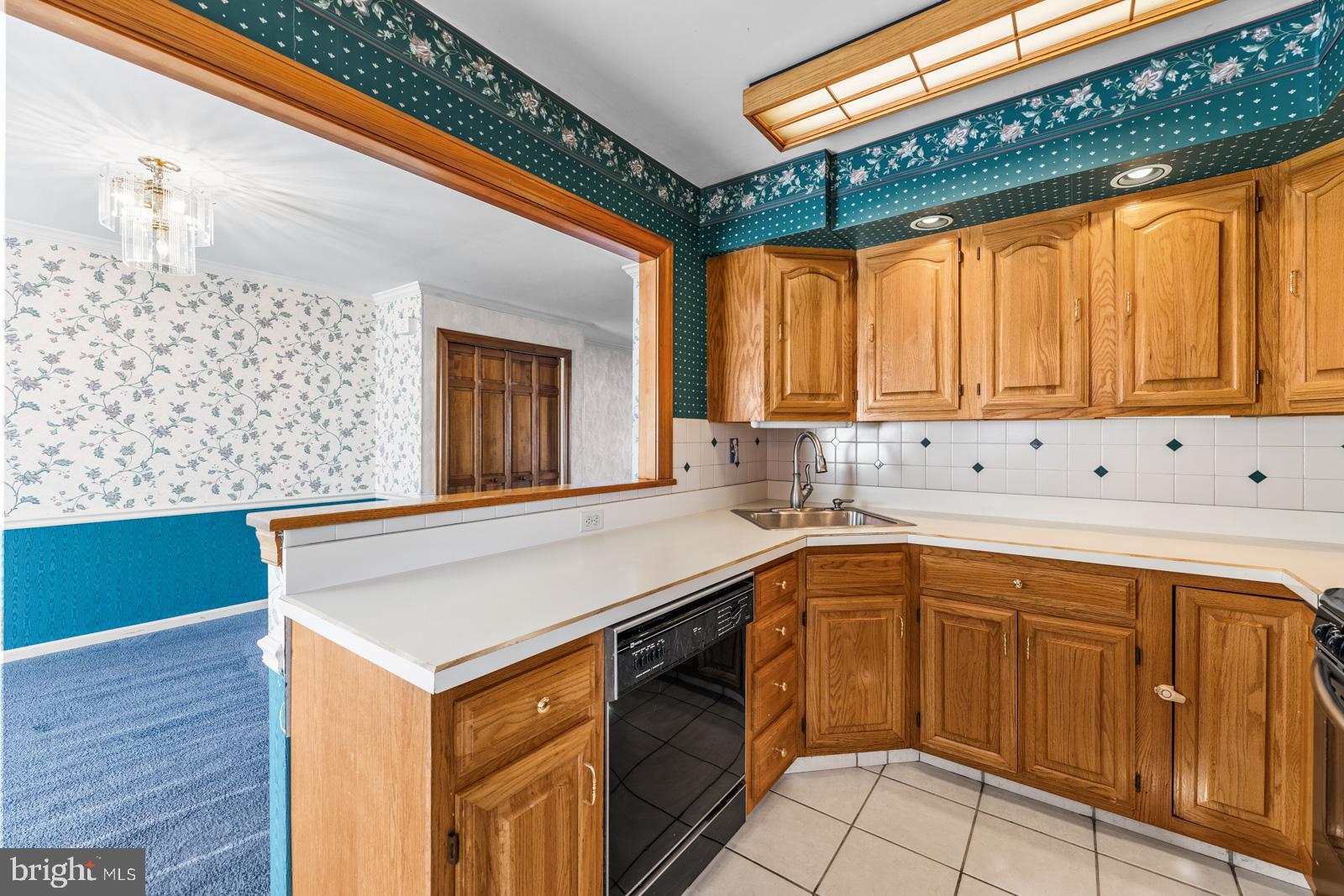 12423 Rambler Road Philadelphia, PA 19154 - Photo 12 of 46 a kitchen with stainless steel appliances a sink and cabinets