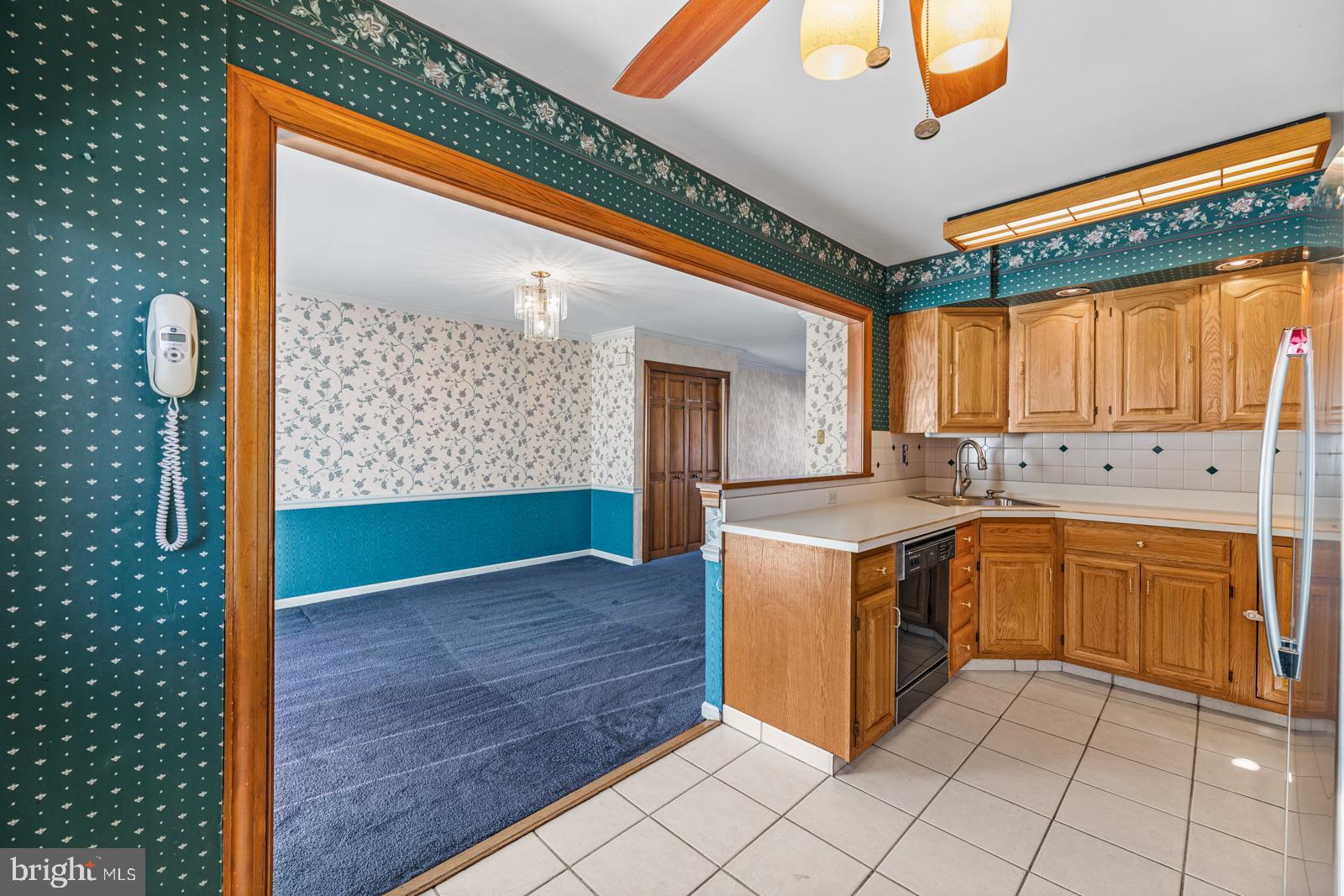 12423 Rambler Road Philadelphia, PA 19154 - Photo 13 of 46 a kitchen with stainless steel appliances granite countertop a stove a sink and a microwave