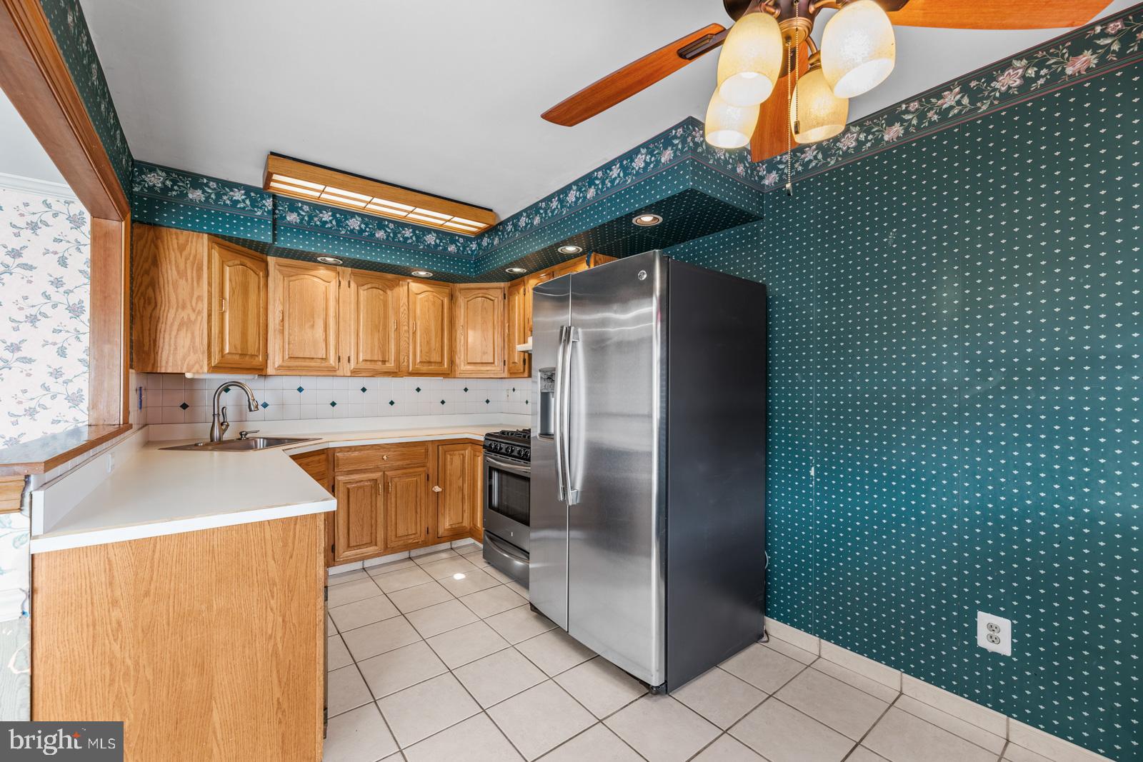 12423 Rambler Road Philadelphia, PA 19154 - Photo 14 of 46 a kitchen with a refrigerator and a sink