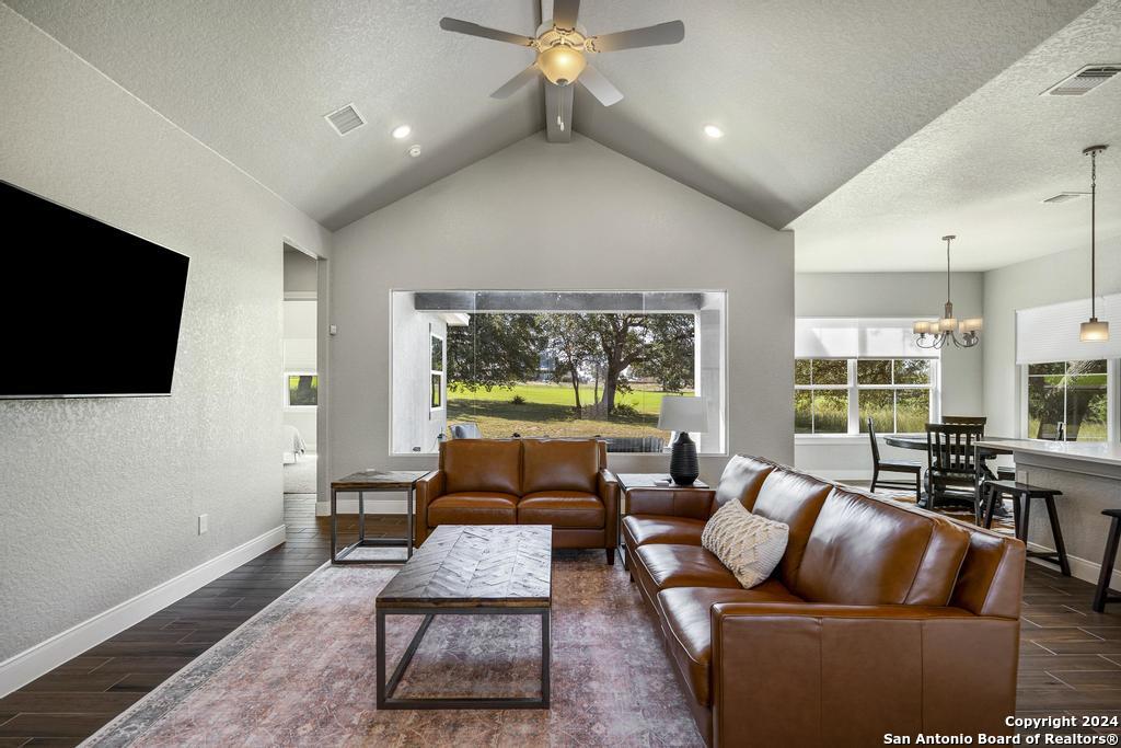 238 Roy Nichols Blanco, TX 78606 - Photo 1 of 1 a living room with furniture a flat screen tv and a large window