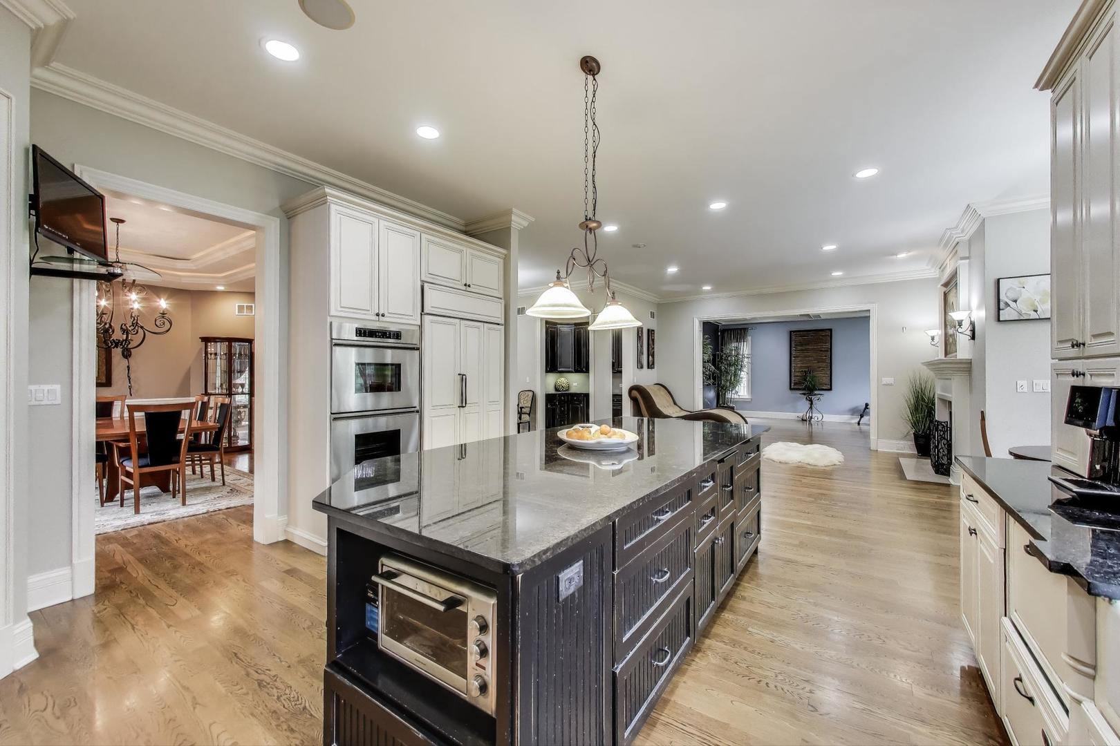 628 Greenwood Road Northbrook, IL 60062 - Photo 13 of 54 a kitchen with stainless steel appliances granite countertop a stove oven and a refrigerator