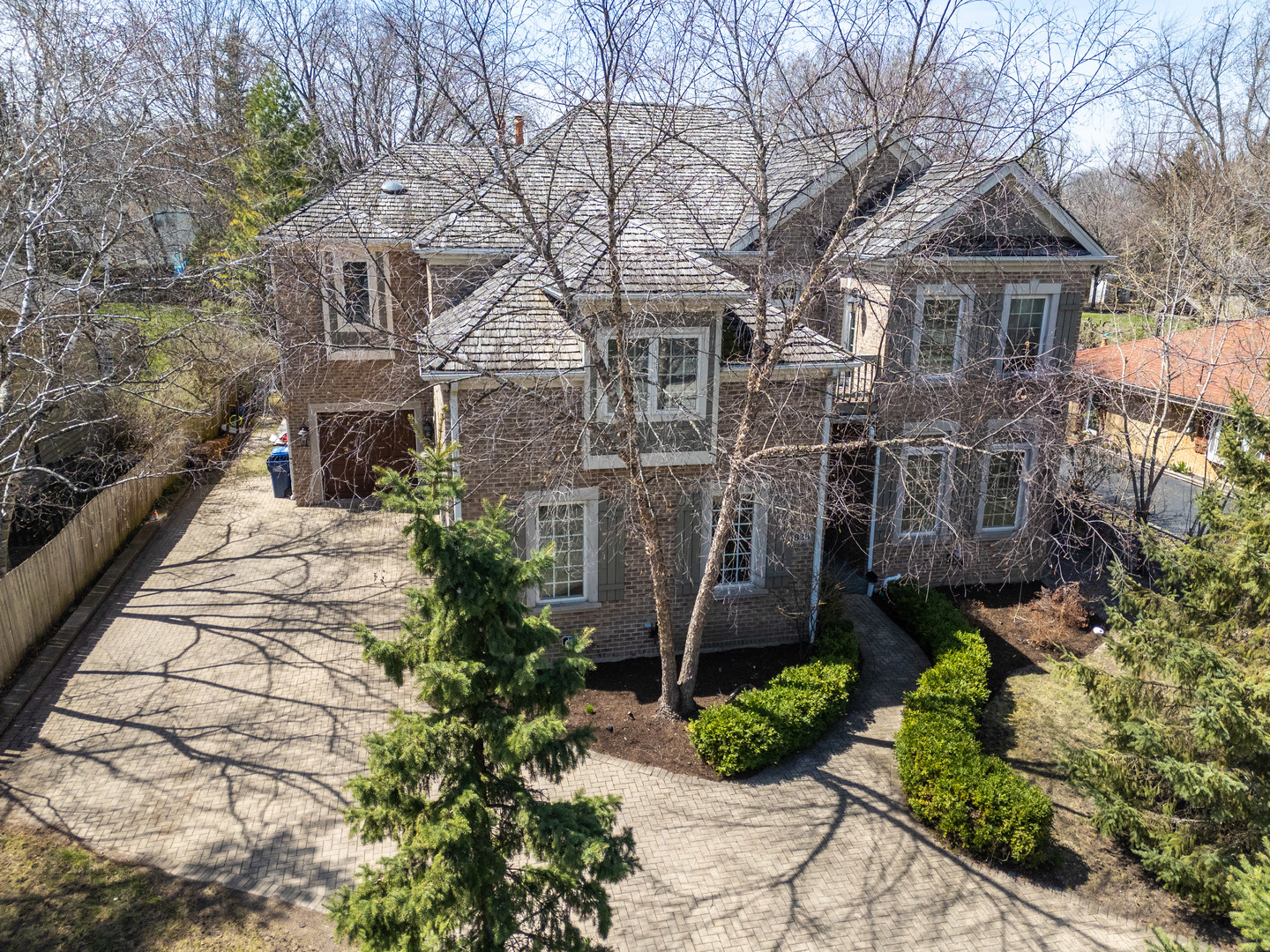 628 Greenwood Road Northbrook, IL 60062 - Photo 2 of 54 a view of a white house next to a yard