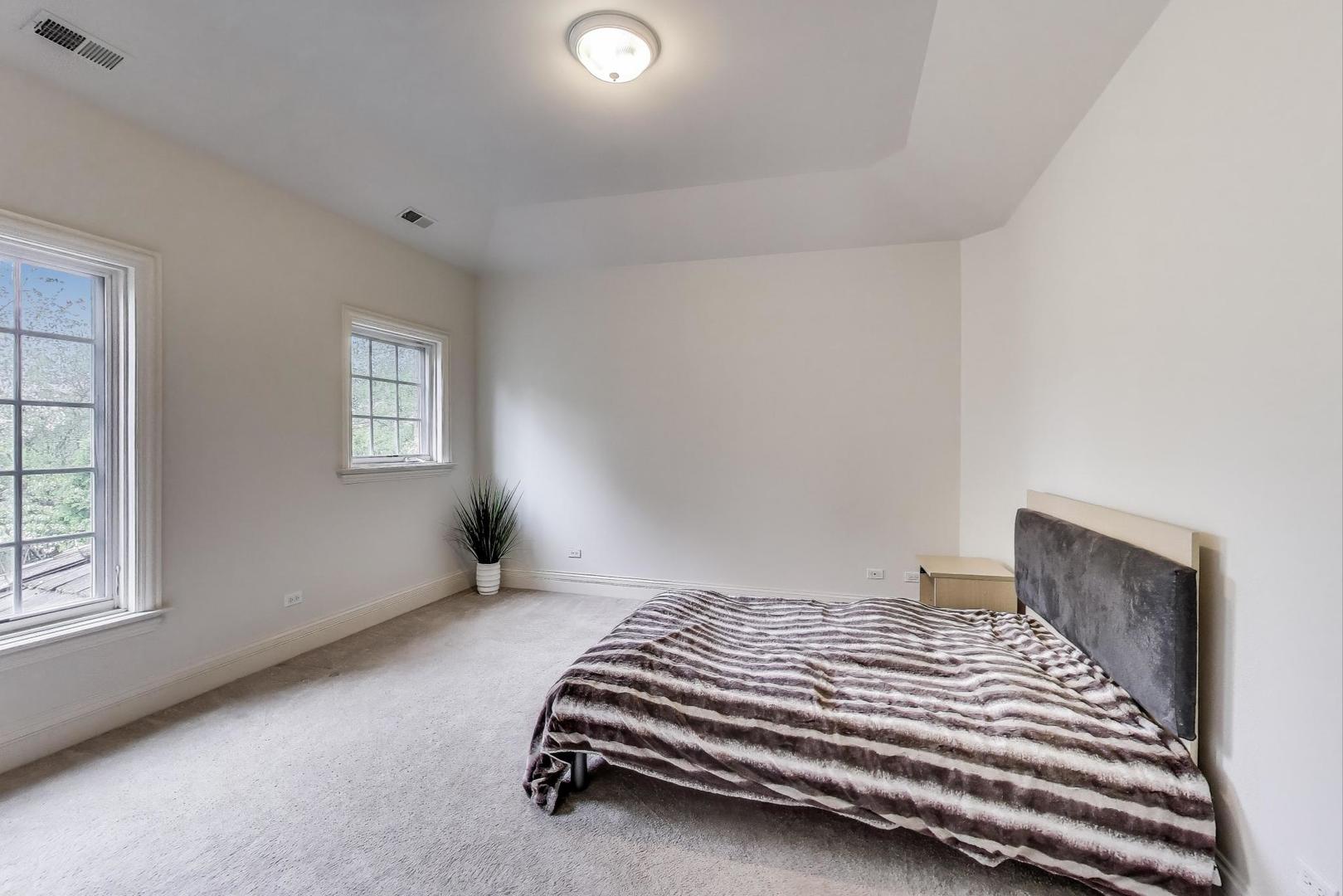 628 Greenwood Road Northbrook, IL 60062 - Photo 30 of 54 a bedroom with bed and window