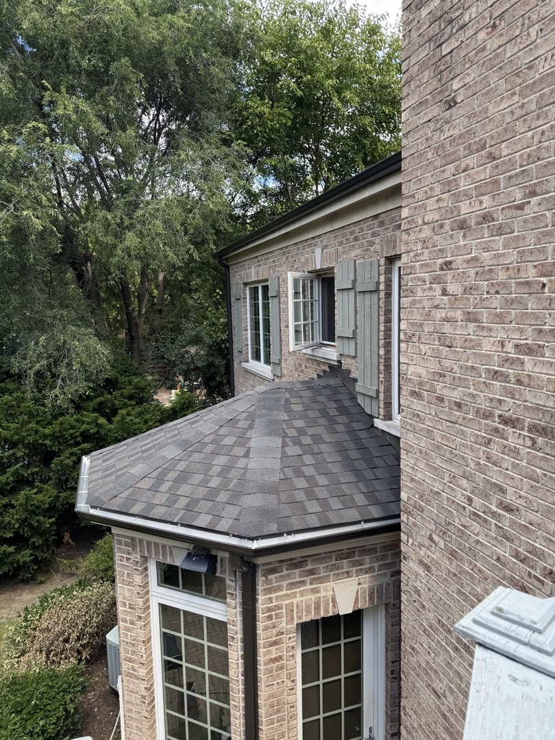 628 Greenwood Road Northbrook, IL 60062 - Photo 3 of 54 a view of a house with brick wall and plants