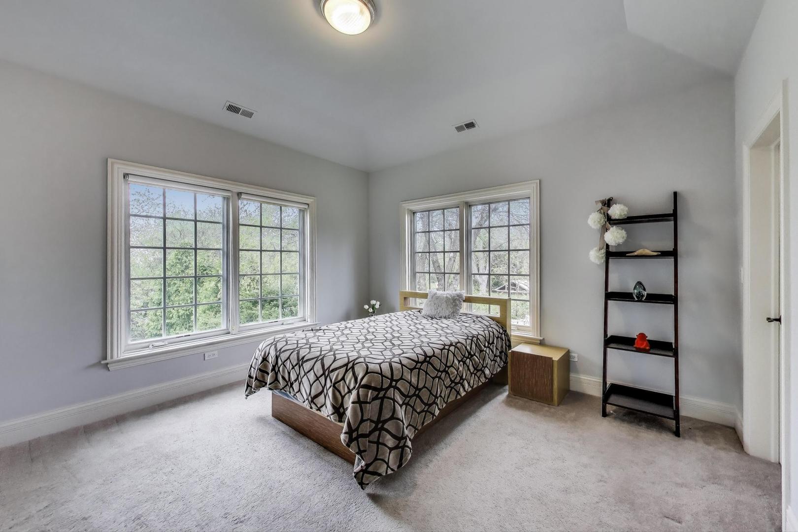 628 Greenwood Road Northbrook, IL 60062 - Photo 32 of 54 a bedroom with a bed and a window