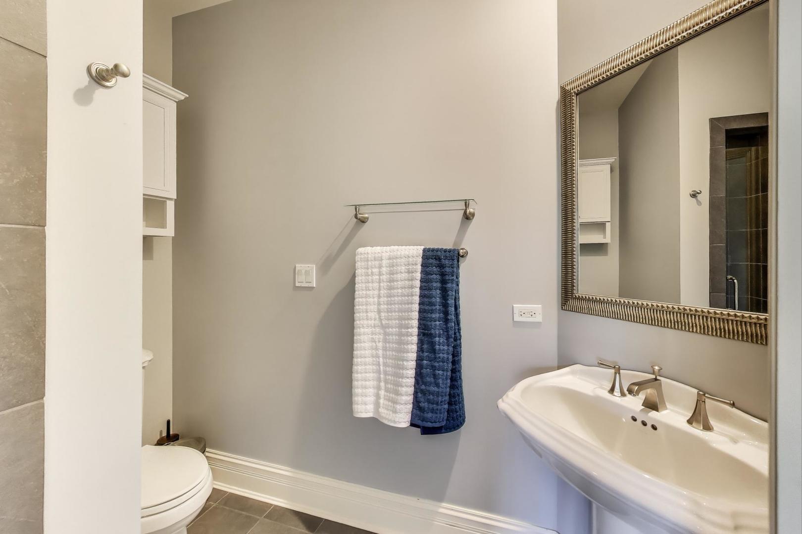 628 Greenwood Road Northbrook, IL 60062 - Photo 33 of 54 a bathroom with a sink toilet and shower