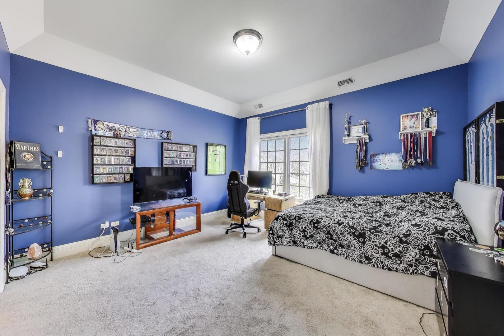 628 Greenwood Road Northbrook, IL 60062 - Photo 34 of 54 a bedroom with furniture and a flat screen tv