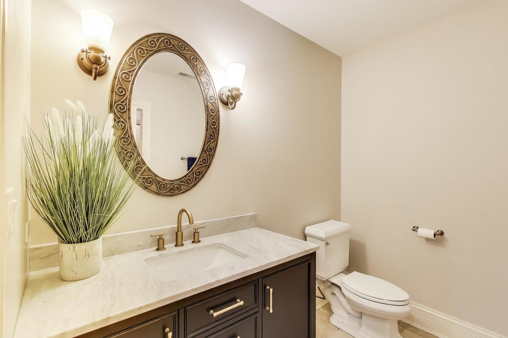 628 Greenwood Road Northbrook, IL 60062 - Photo 46 of 54 a bathroom with a sink a toilet and a mirror