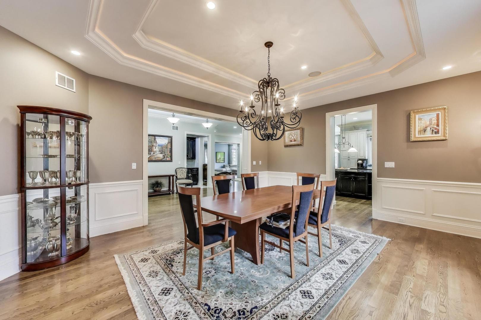 628 Greenwood Road Northbrook, IL 60062 - Photo 9 of 54 a view of a dining room with furniture and chandelier