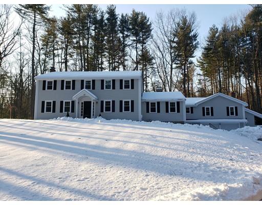 281 Hunters Ridge Road Concord, MA 01742 - Photo 1 of 26 a front view of a house with a yard and trees