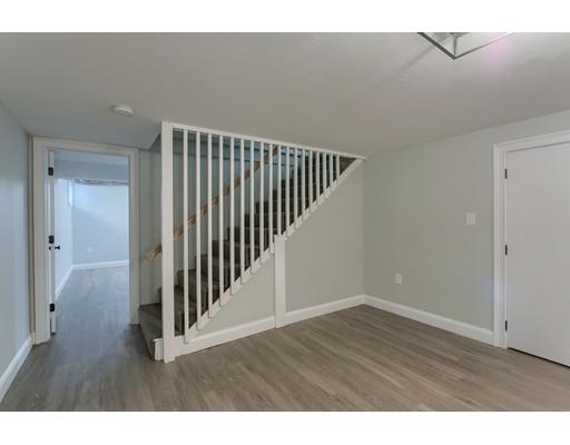 281 Hunters Ridge Road Concord, MA 01742 - Photo 21 of 26 a view of a hallway with wooden floor