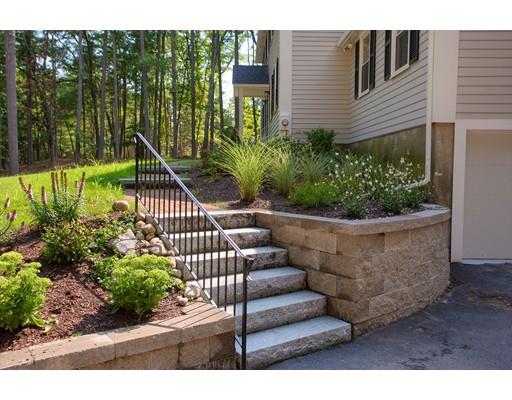 281 Hunters Ridge Road Concord, MA 01742 - Photo 24 of 26 a view of a fountain with flower plants