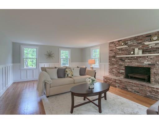 281 Hunters Ridge Road Concord, MA 01742 - Photo 4 of 26 a living room with furniture a window and a fireplace