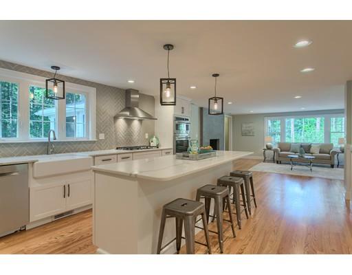 281 Hunters Ridge Road Concord, MA 01742 - Photo 6 of 26 a kitchen with lots of counter top space and living room