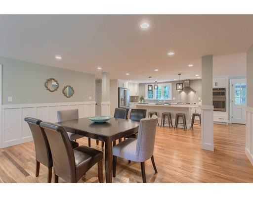 281 Hunters Ridge Road Concord, MA 01742 - Photo 9 of 26 a dining room with furniture and wooden floor