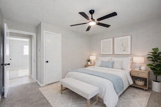 4735 Theall Road Houston, TX 77066 - Photo 28 of 38 a bedroom with a large bed and a chandelier
