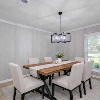 4735 Theall Road Houston, TX 77066 - Photo 4 of 38 a view of a dining room with furniture window and wooden floor