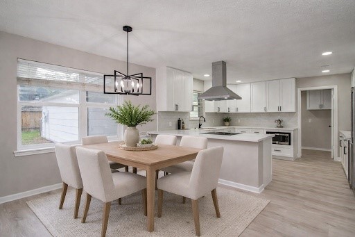 4735 Theall Road Houston, TX 77066 - Photo 5 of 38 a view of a dining room with furniture window and wooden floor