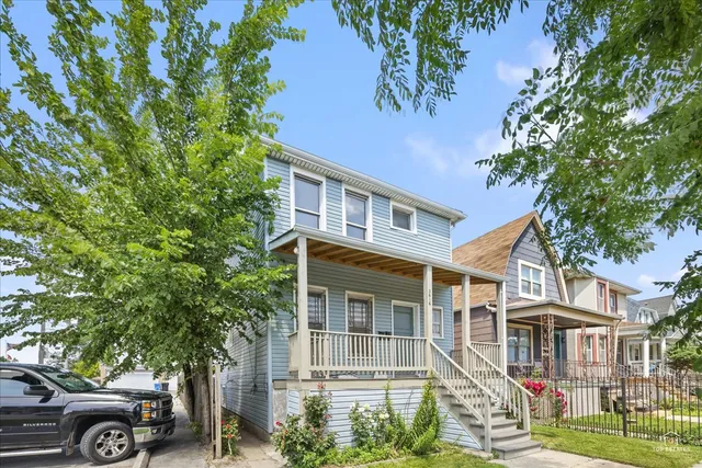 front view of a house with a garden