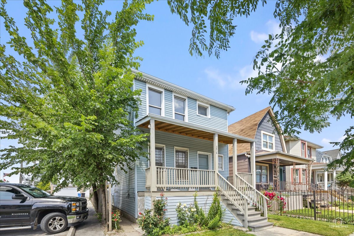 front view of a house with a garden