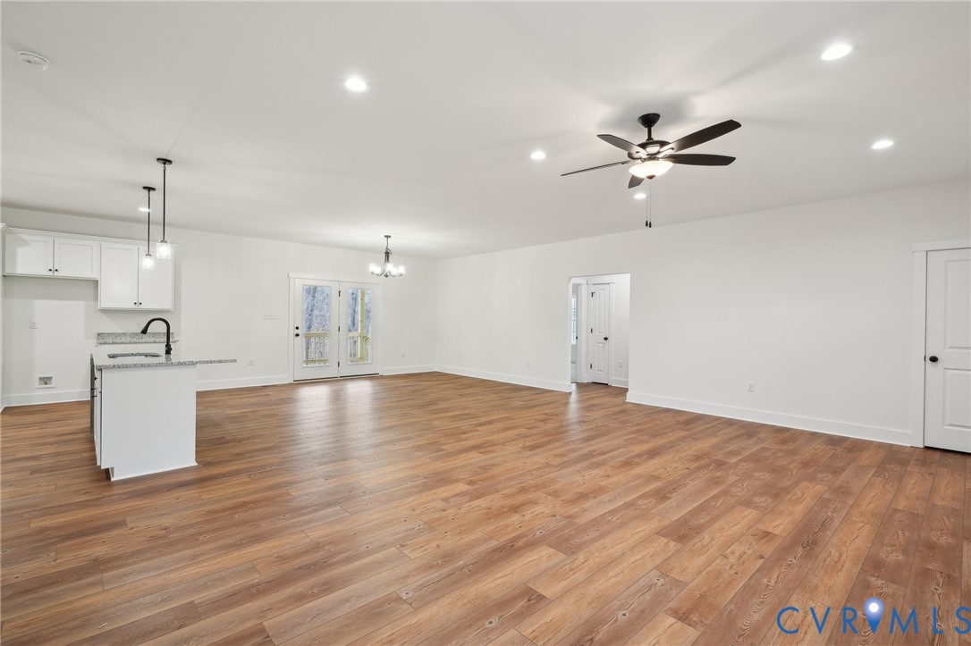2090 Cartersville Road Cartersville, VA 23027 - Photo 7 of 35 a view of empty room with wooden floor and ceiling fan