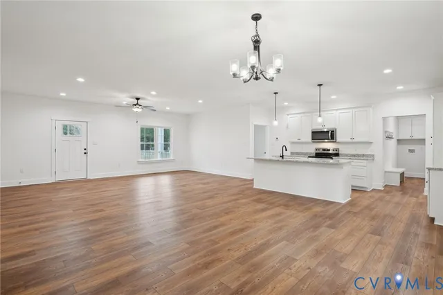 a view of kitchen with refrigerator and window