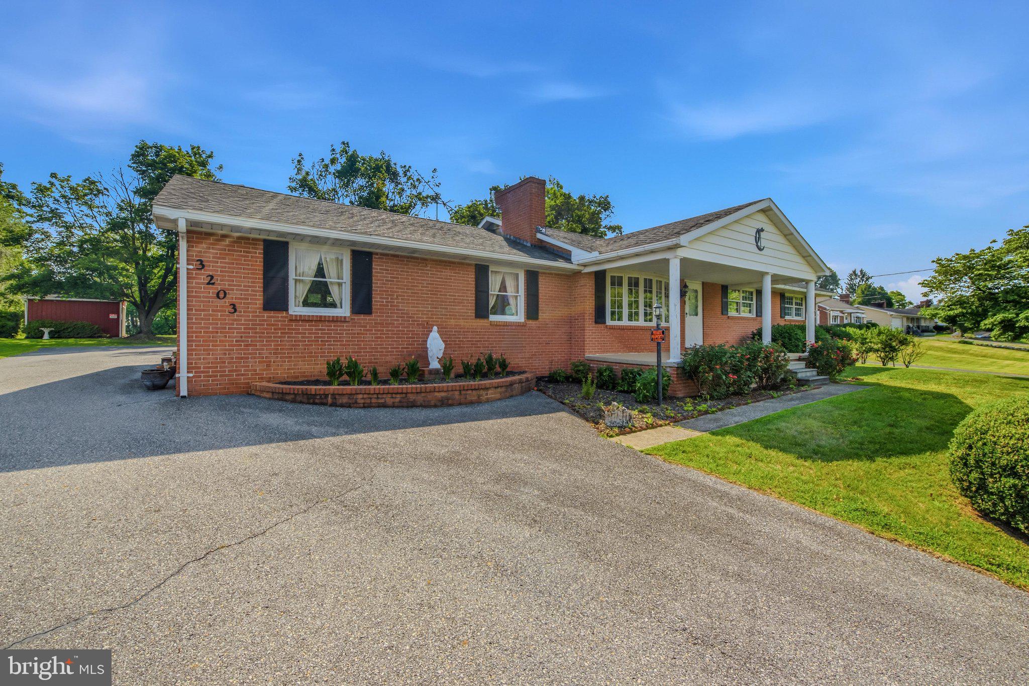 3203 Charles Town Road Kearneysville, WV 25430 - Photo 2 of 45 Features a large driveway to rear load garage