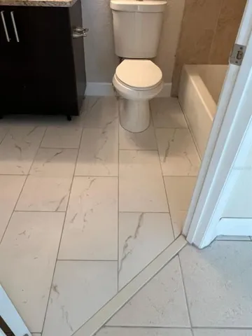 a bathroom with a toilet and a vanity