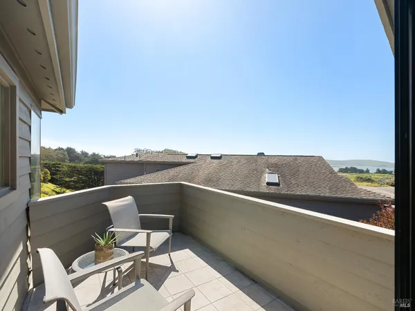 a terrace of a house with outdoor seating