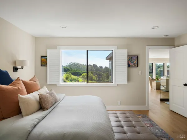 a bedroom with a bed and window