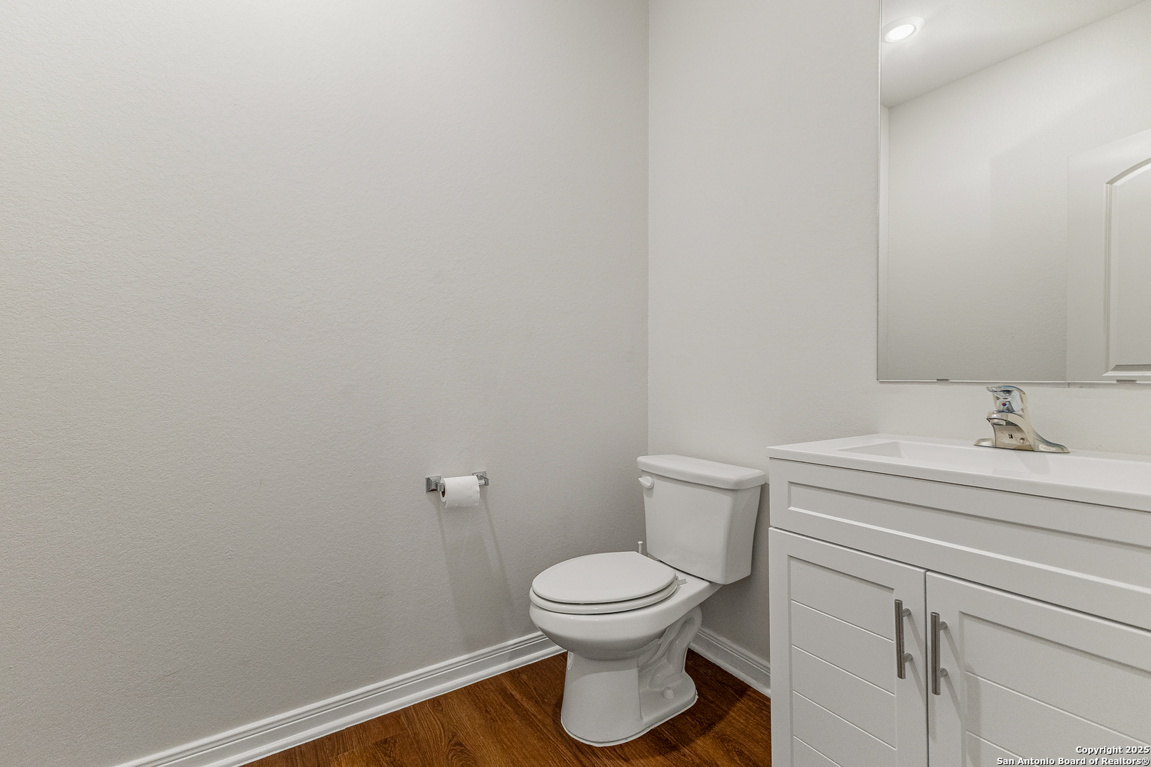 15102 Jetfire Von Ormy, TX 78073 - Photo 11 of 37 a bathroom with a toilet a sink and mirror