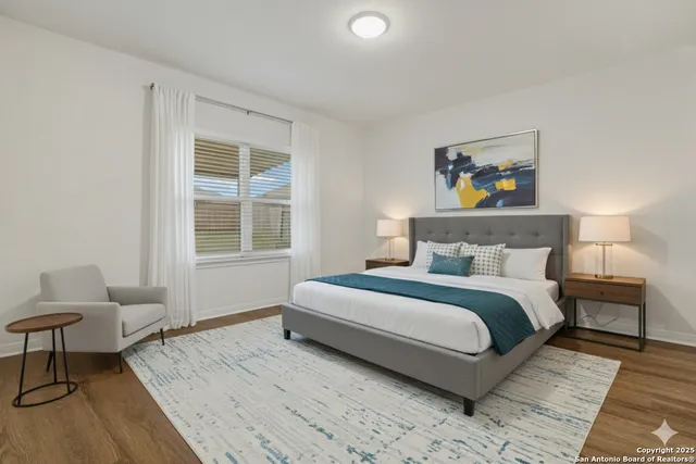 a bedroom with bed and a window