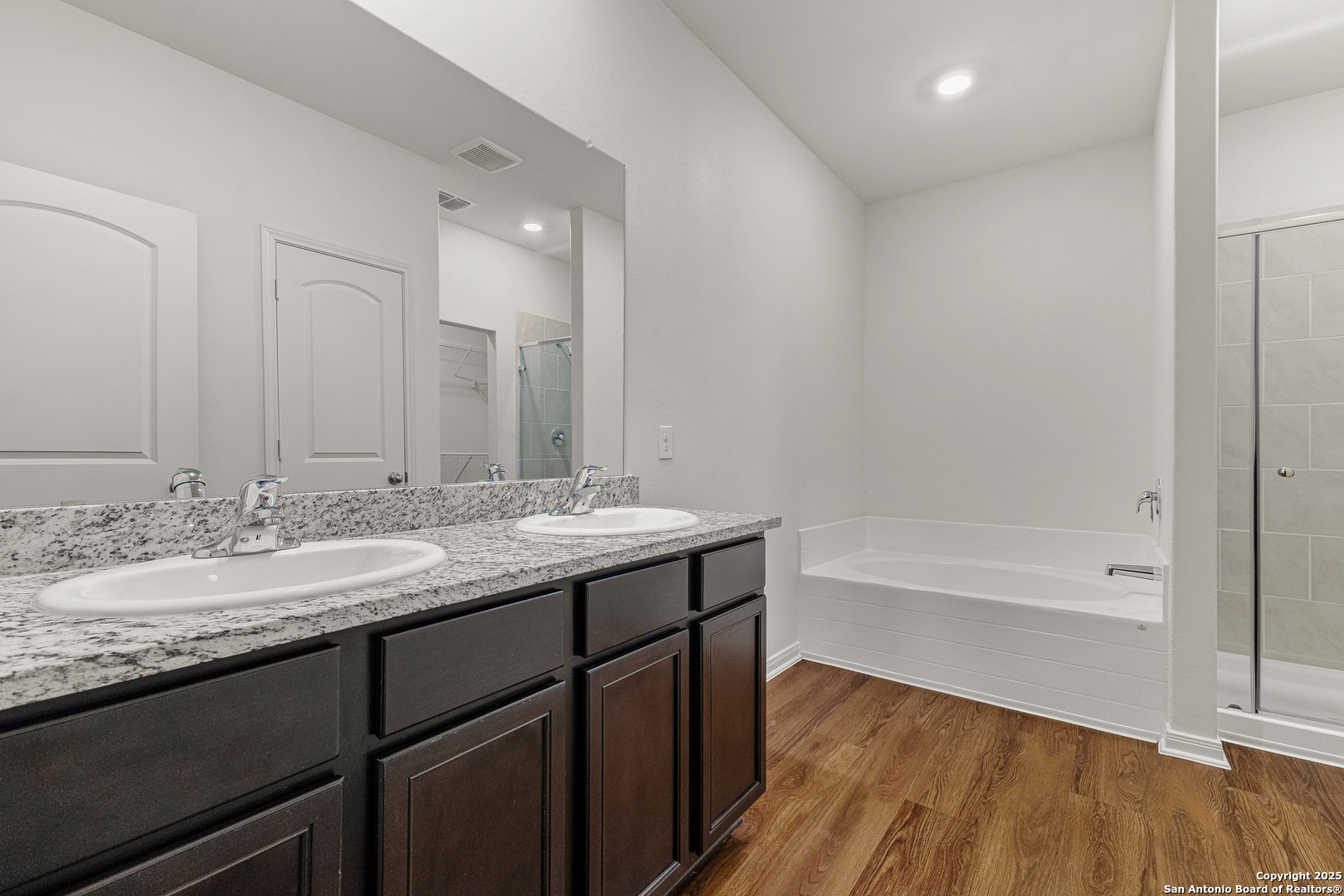 15102 Jetfire Von Ormy, TX 78073 - Photo 19 of 37 a bathroom with a granite countertop sink mirror and a bath tub