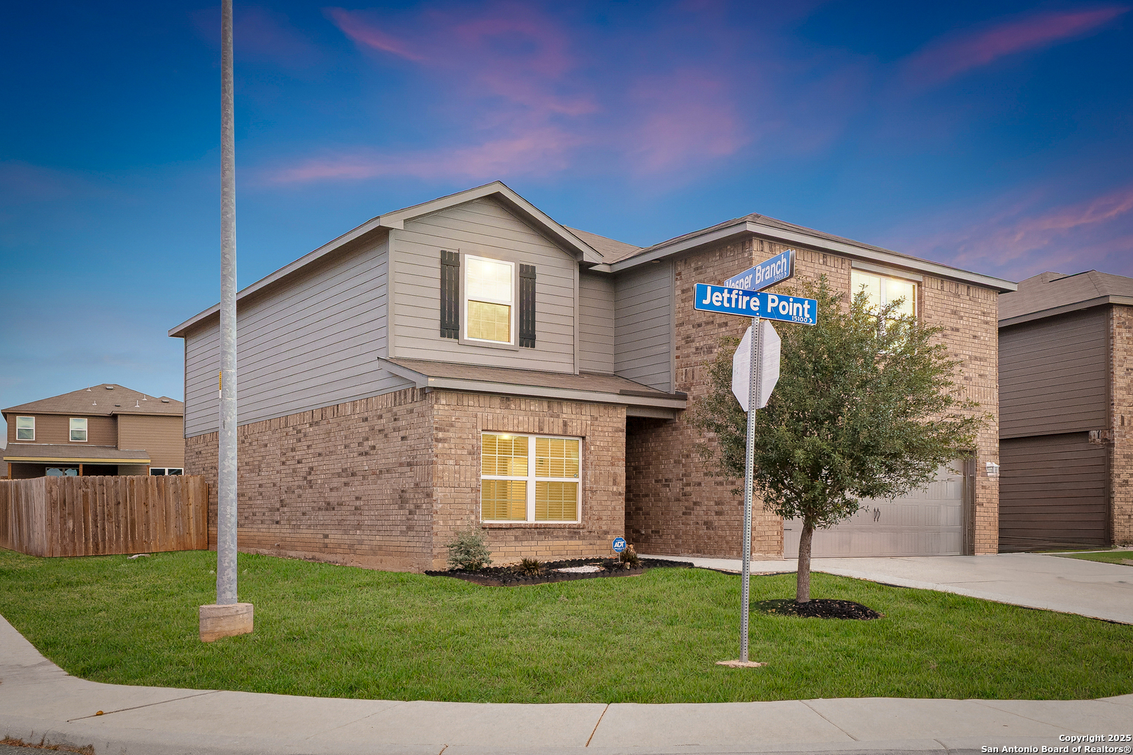 15102 Jetfire Von Ormy, TX 78073 - Photo 3 of 37 a front view of a house with a garden