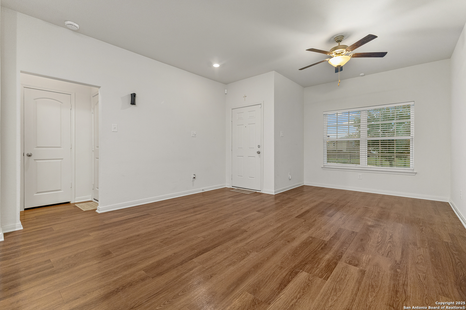15102 Jetfire Von Ormy, TX 78073 - Photo 9 of 37 wooden floor in an empty room with a window