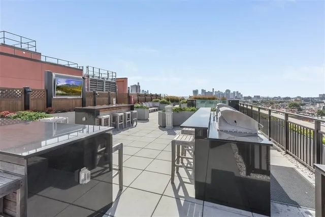 a view of city from terrace along with seating space