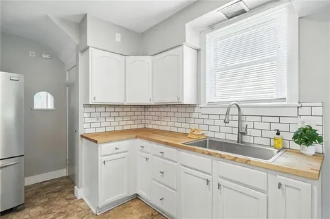 a kitchen with a sink and cabinets