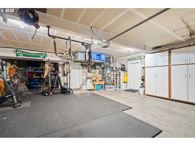 a backyard of a house with barbeque oven table and chairs