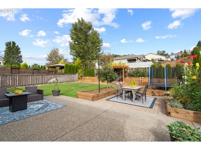 a view of a patio with a table and chairs