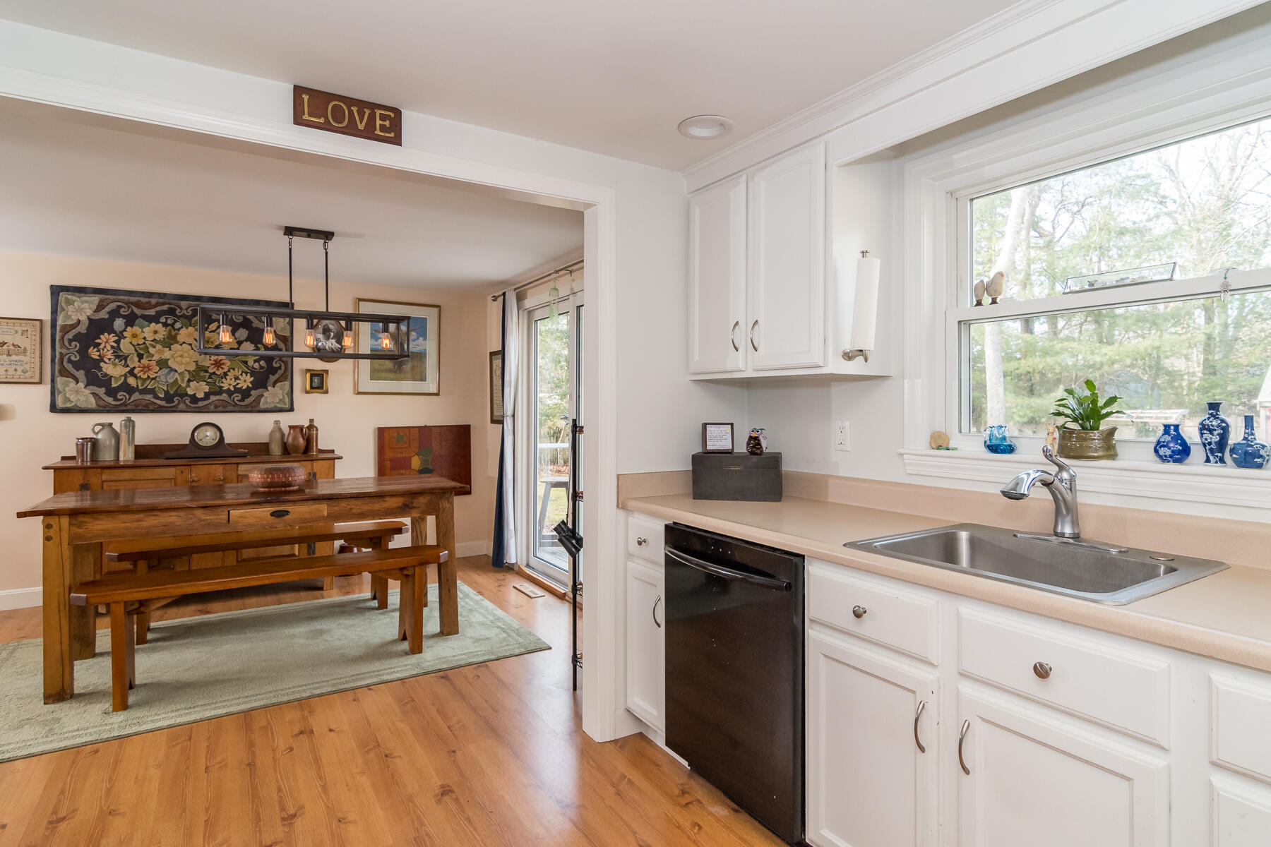 99 Sheaffer Road Centerville, MA 02632 - Photo 9 of 24 a kitchen with a sink cabinets and window