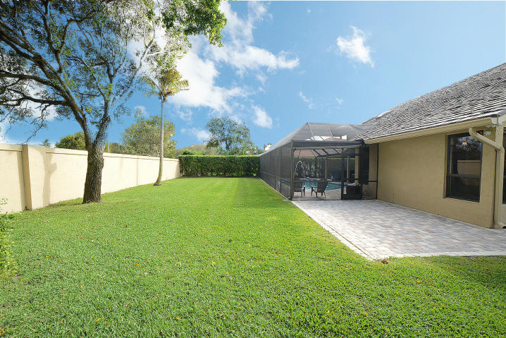 5686 St Annes Way Boca Raton, FL 33496 - Photo 18 of 18 a view of a house with backyard and a tree