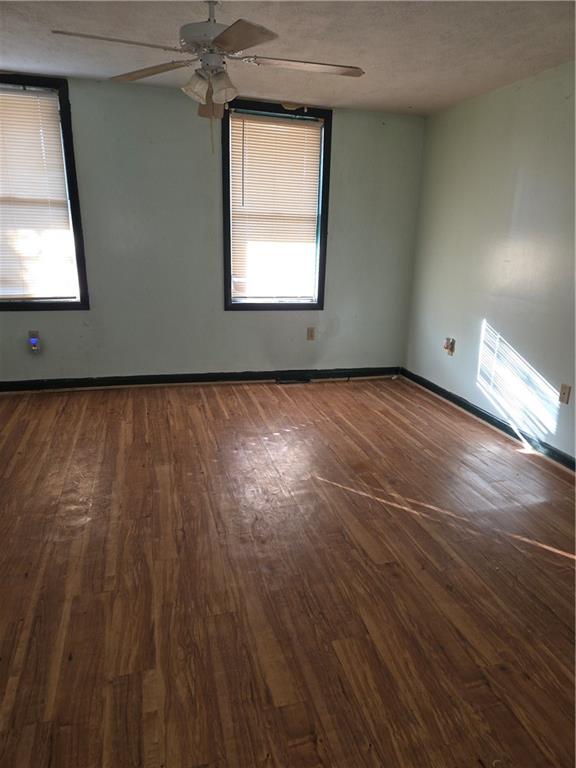 2509 Webster Avenue Pittsburgh, PA 15219 - Photo 5 of 19 an empty room with wooden floor and windows