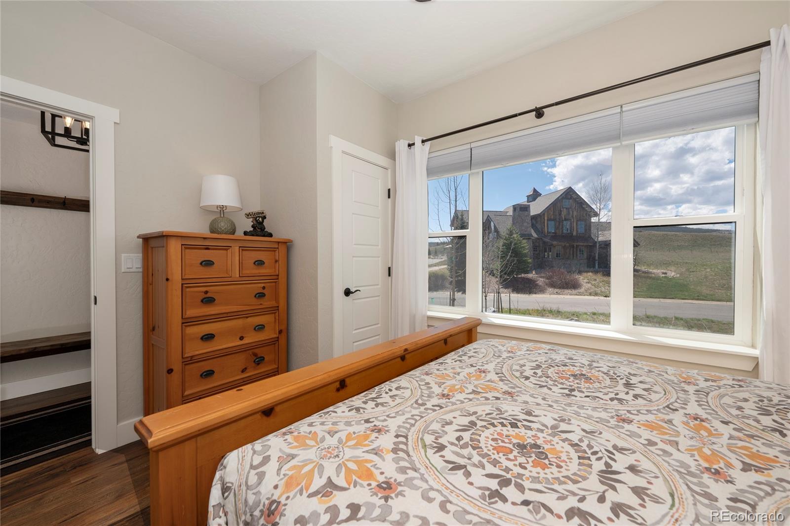 719 Saddle Ridge Circle Granby, CO 80446 - Photo 13 of 47 a bedroom with a bed and a window