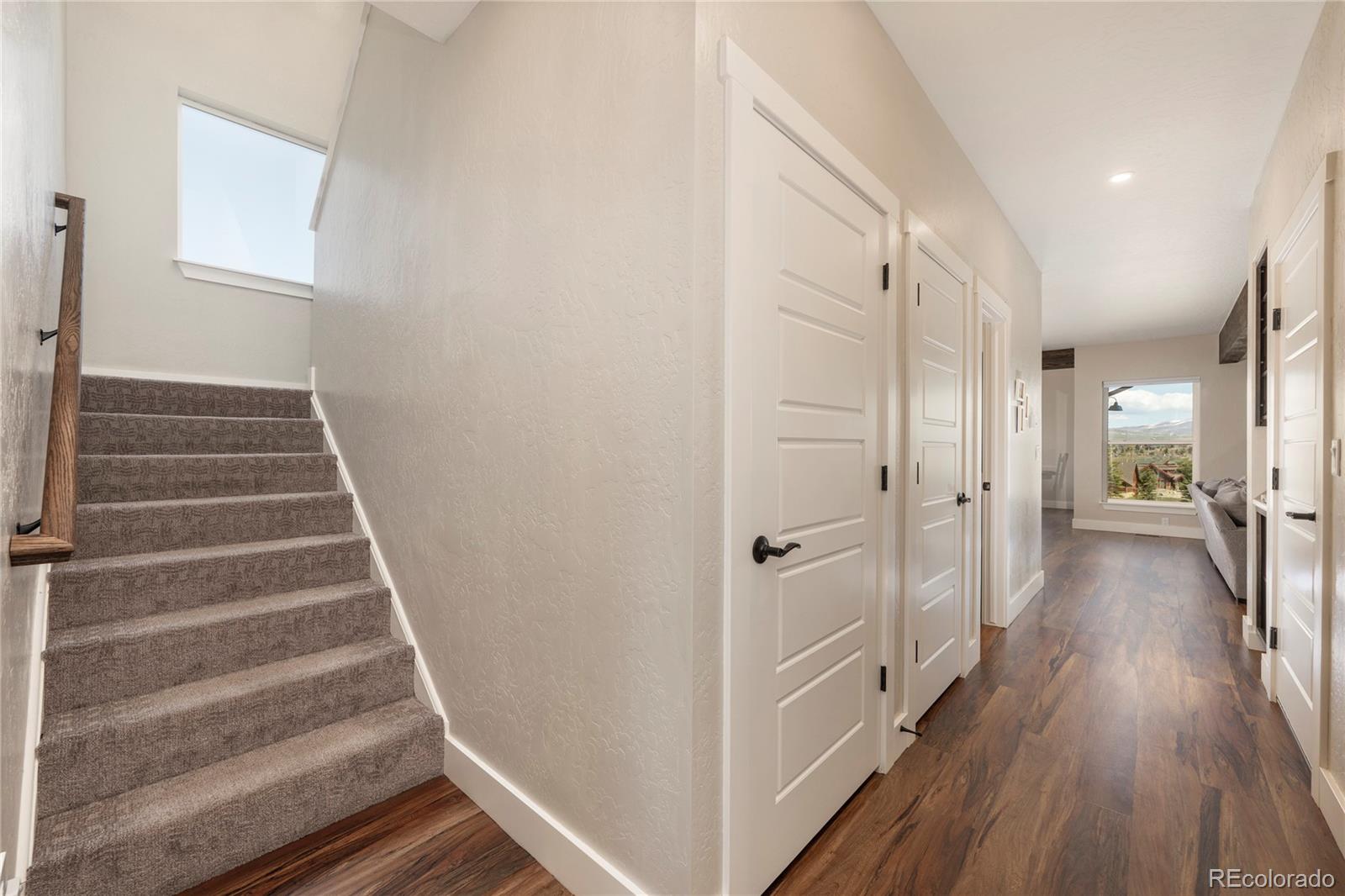 719 Saddle Ridge Circle Granby, CO 80446 - Photo 15 of 47 a view of a hallway with wooden floor and entryway