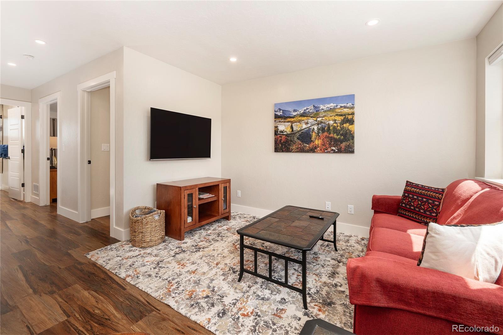 719 Saddle Ridge Circle Granby, CO 80446 - Photo 16 of 47 a living room with furniture and a flat screen tv